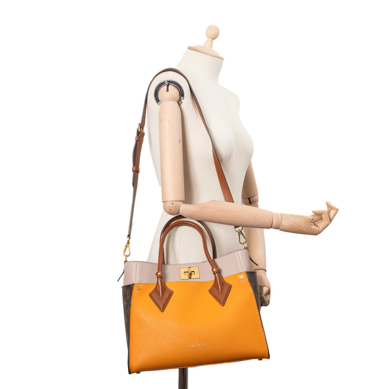 On my side leather handbag Louis Vuitton Orange in Leather - 33792674